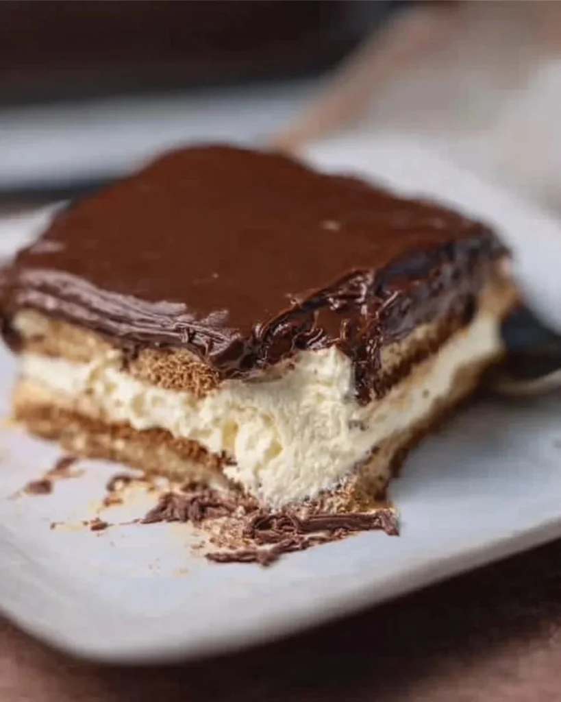 Delicious Chocolate Eclair Cake, an easy make-ahead dessert for any occasion.